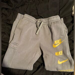 Nike Kids Gray Joggers with Yellow Accents